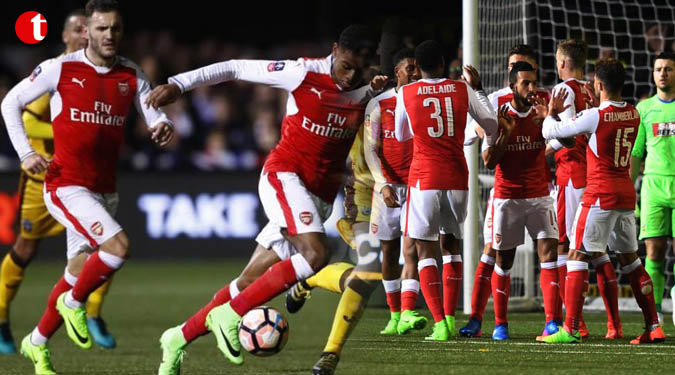 100th goal for Walcott as Arsenal end Sutton's dream run