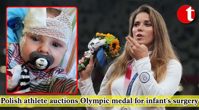 Polish athlete auctions Olympic medal for infant's surgery